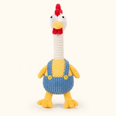 Long-neck plush chicken squeaky dog toy in blue overalls on cream background