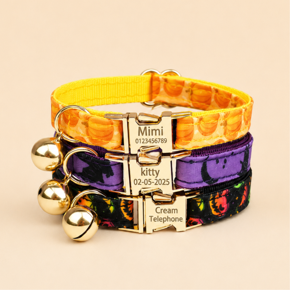 Halloween cat collars stacked - orange pumpkin, purple bat and black jack-o-lantern prints with gold bells and engraved nameplates
