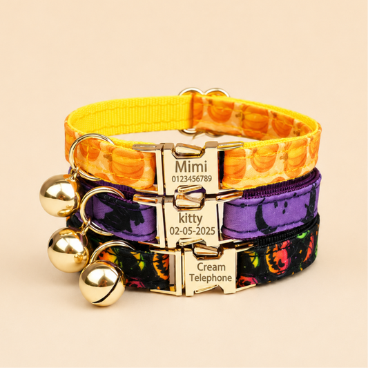 Halloween cat collars stacked - orange pumpkin, purple bat and black jack-o-lantern prints with gold bells and engraved nameplates