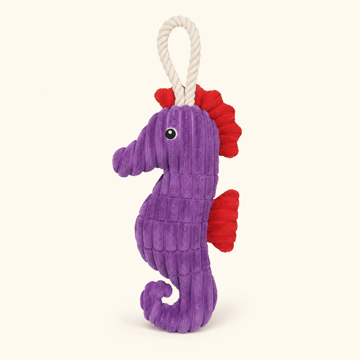 Purple crinkle plush seahorse squeaky dog toy with rope loop on cream background