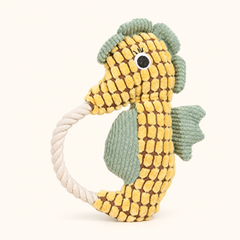 Yellow crinkle plush seahorse squeaky dog toy with rope loop on cream background