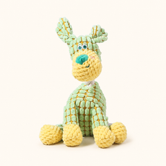 Green dog corduroy squeaky dog toy on cream background