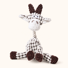 White goat corduroy squeaky dog toy on cream background